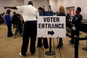 Voters wait in line to cast their ballots during early voting at the Franklin County Board of Elections in Columbus, in Columbus