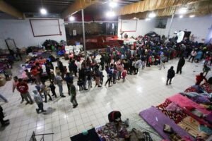 Migrants take part in a Posada ahead of Christmas, in Tijuana
