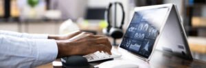 African Businessman Using Analytics Data KPI Dashboard Tech